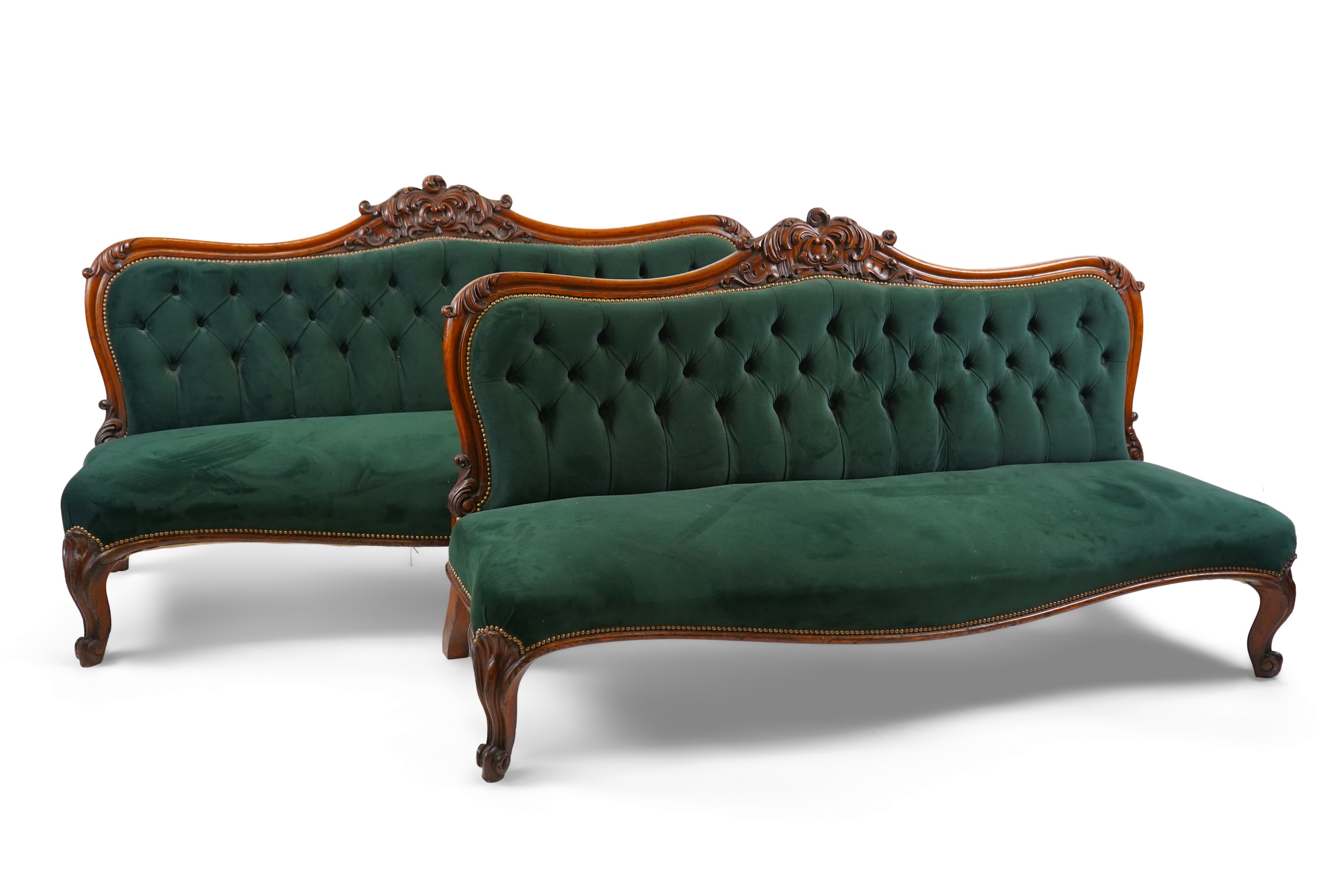 A pair of Victorian carved oak settees